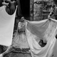 Zeenat unfolds her Mukaish apparel cast out of real gold and silver wires. Deorhi Agha Meer, Old Lucknow, Uttar Pradesh.